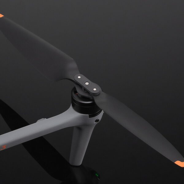 Original DJI Air 3 Series Low-Noise Propellers model 8747F isolated on black background