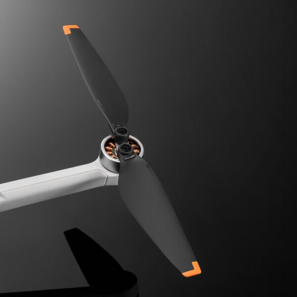 Original DJI Mini 3/Lito Series Propellers model 6030F isolated on black background